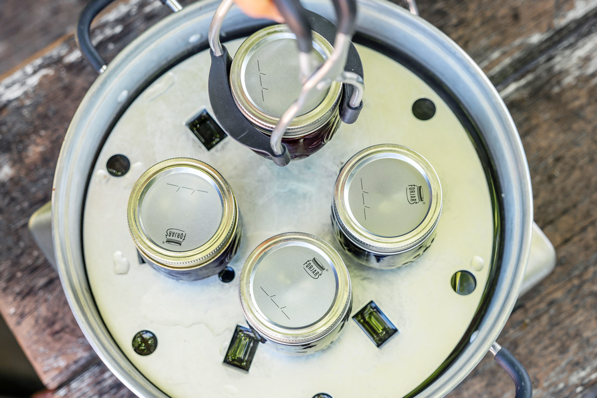 Jars of blueberry jam on a steam canner.