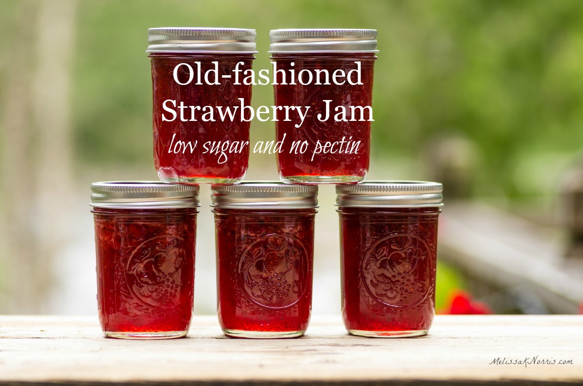five jars of homemade jam without pectin stacked on a railing.