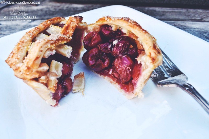 mini cherry pies in a muffin tin