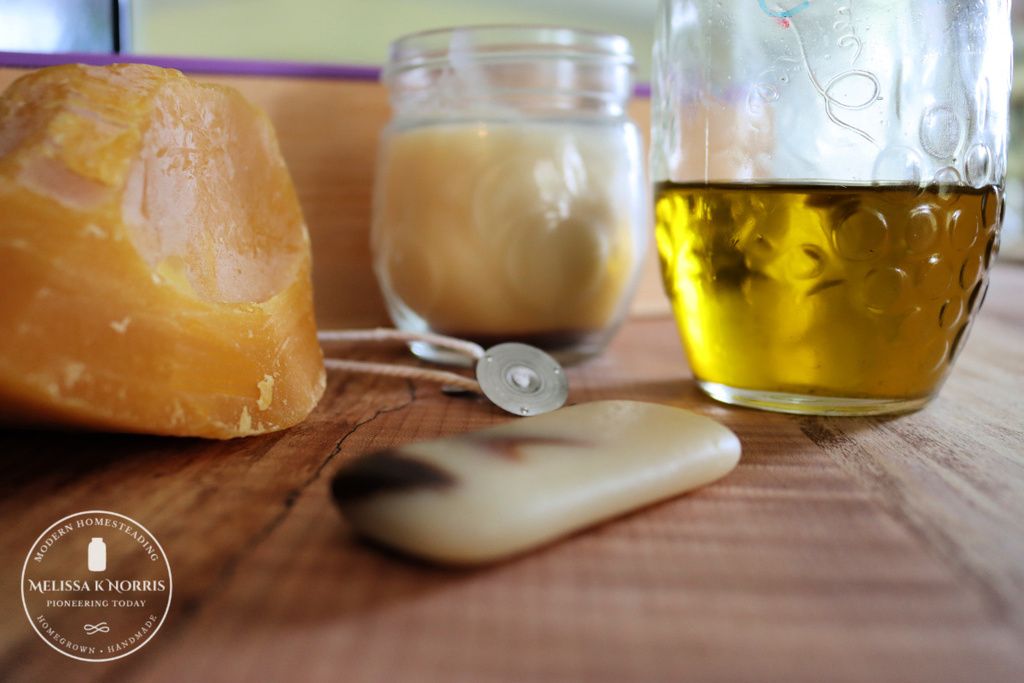 non-food items to keep on hand beeswax, oil, wicks, homemade candle, homemade soap on counter