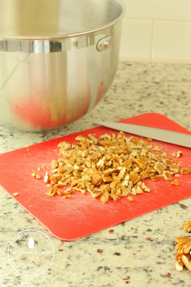 Chopped nuts on a cutting board.