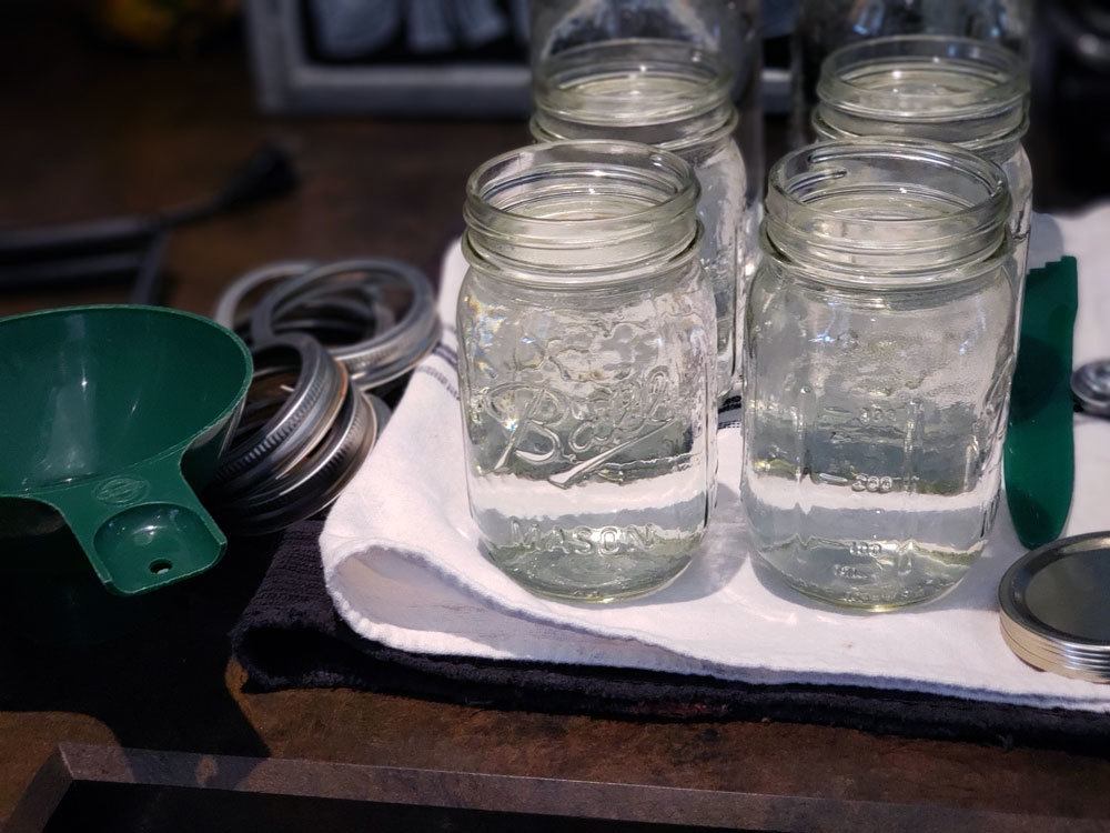 Mason jars filled with hot water.