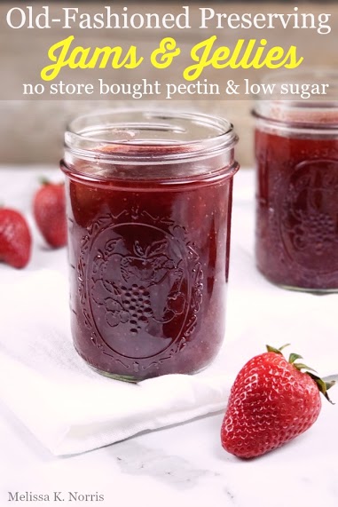 jars of strawberry jam on white towel