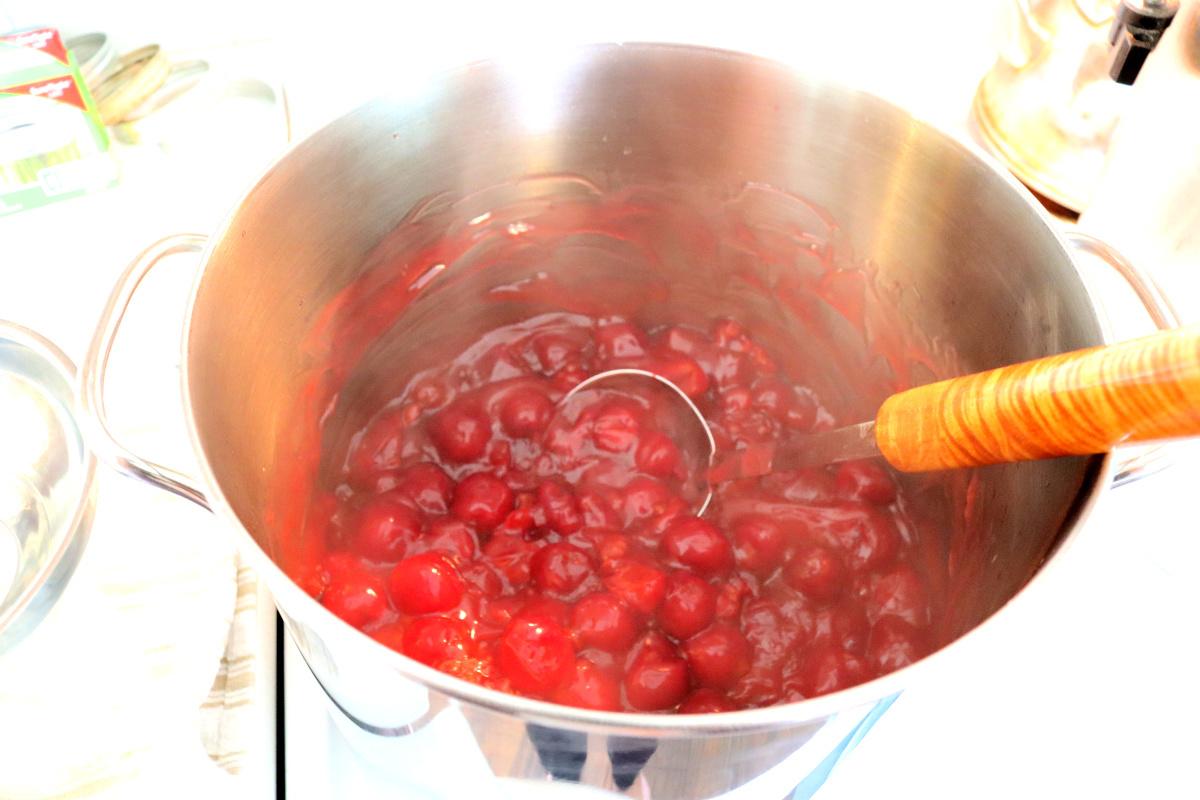 homemade cherry pie filling in large saucepan on stove