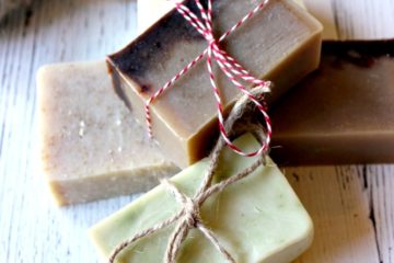 5 bars of soap with decorative twine tied around them as gifts.