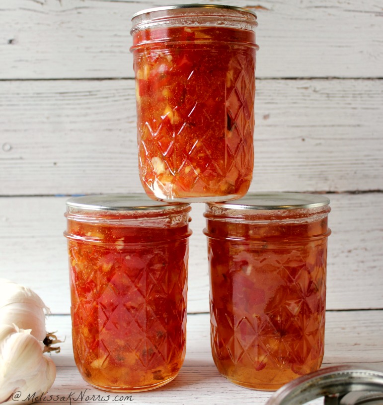 Three jars of red pepper jelly.