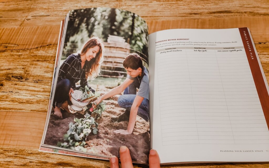 Family Garden Plan open to a picture of a mother and daughter gardening.