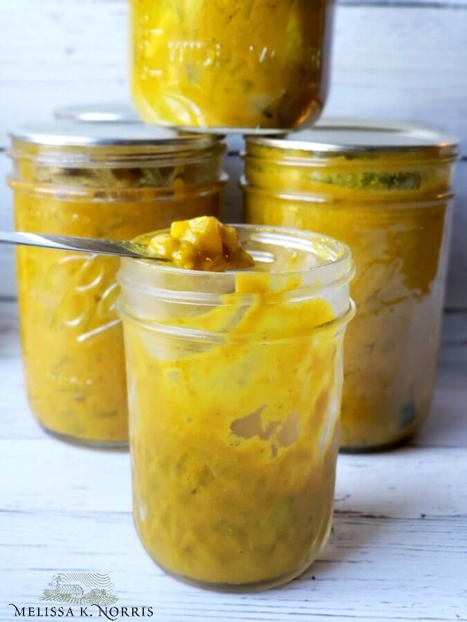 Four jars of mustard pickles.