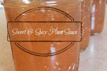 Three mason jars filled with sweet and spicy plum sauce. Text overlay says, "Sweet & Spicy Plum Sauce".