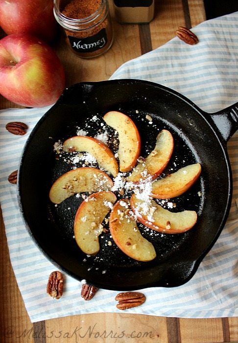Fried apples in a cast iron pan.