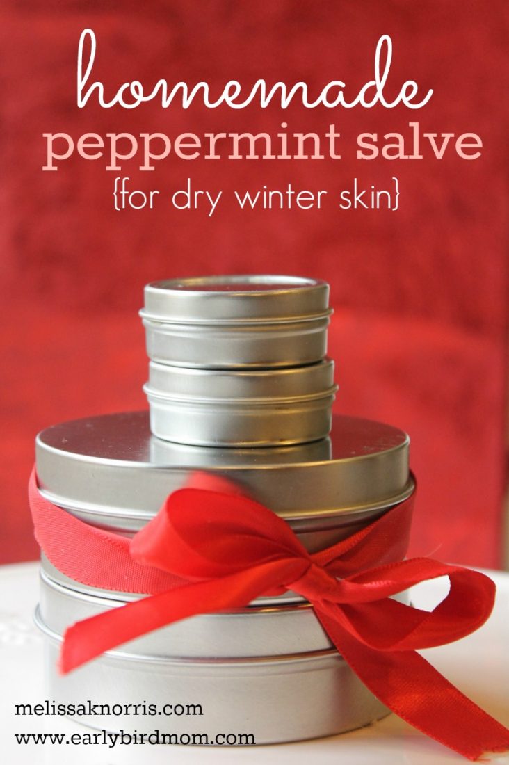 Pinterest pin with an image of various sized round tins stacked on top of each other, and tied with a bow. Text overlay reads "Homemade Peppermint Salve (for dry winter skin)".