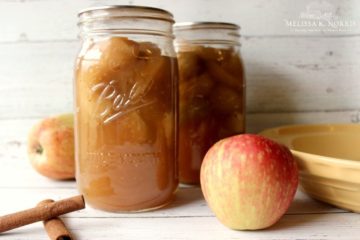Pinterest Pin containing several images of apples, a 4 oz. Mason jar filled with apple butter, quart sized Mason Jars filled with apple pie filling, and pint size Mason Jar filled with apple cider vinegar. Text overlay says, "11 Easy Ways to Preserve Apples at Home".