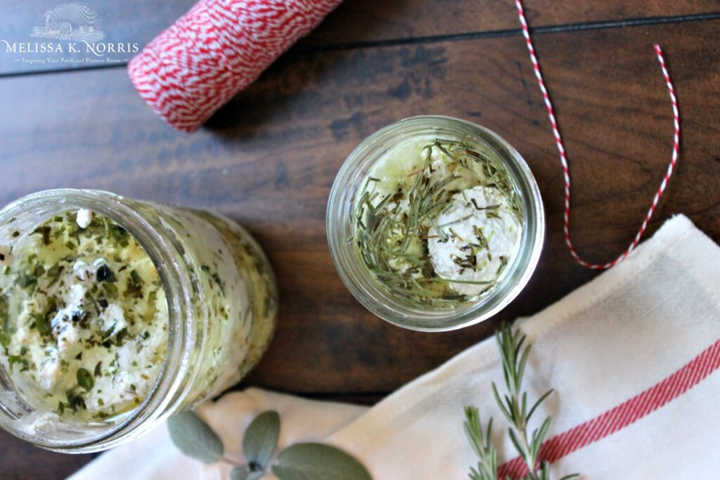 marinated cheese in mason jars.