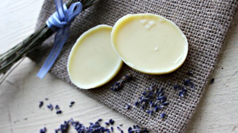 Two lotion bars siting on a table.