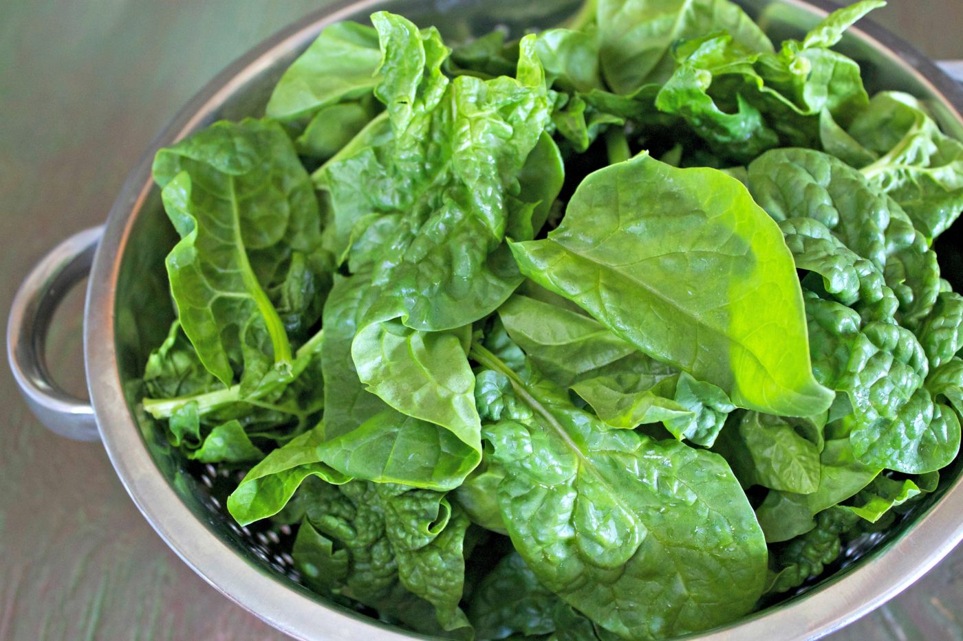 Pasta sauce with spinach in a large pot.