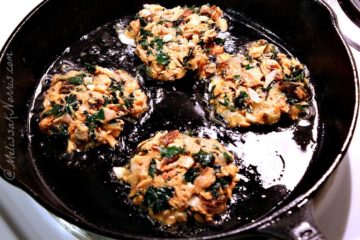 Close up image of salmon kale cakes served on a white platter. Text overlay says "@melissaknorris.com".