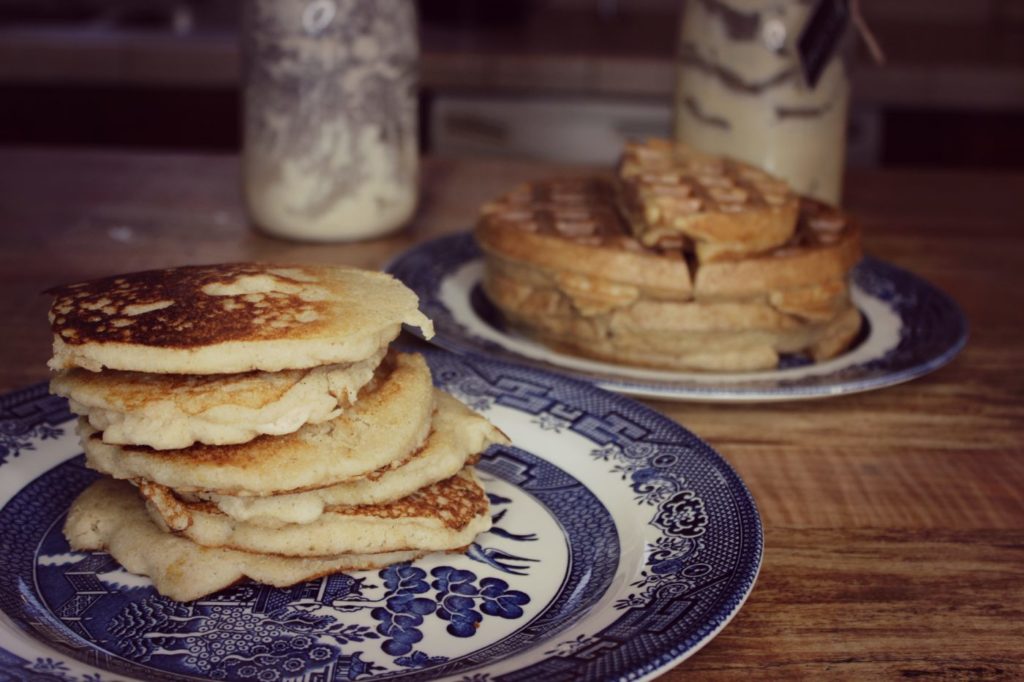 A stack of sourdough pancakes on a plate.