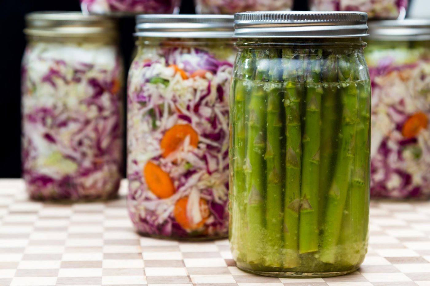 fermented asparagus and sauerkraut in mason jars