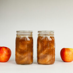Canned apple pie filling with apples.