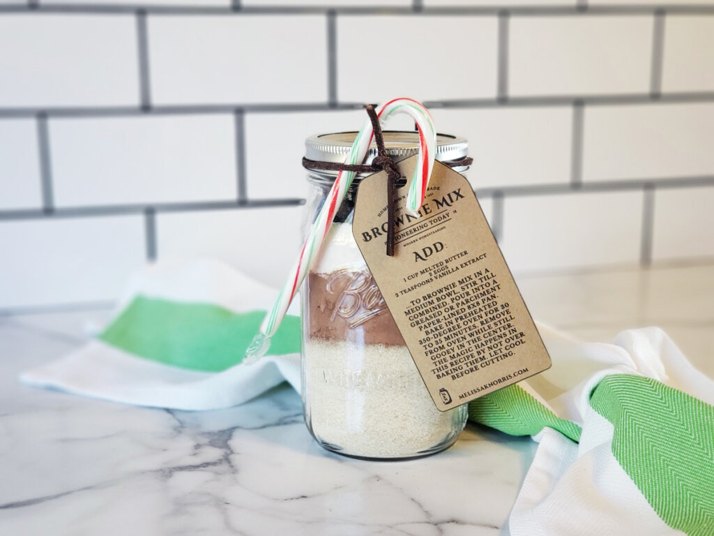 DIY brownie mix in a jar sitting on a counter.