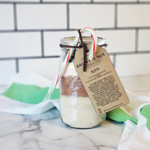 DIY brownie mix in a jar sitting on a counter.