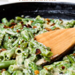 Pinterest pin with an image of green bean casserole and a wooden spoon.