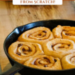 Pinterest pin with an image of chocolate caramel cinnamon rolls in a cast iron skillet.