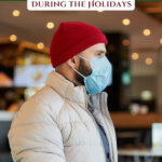 Picture of a man in a red beanie wearing a mask. Pinterest pin for Dealing with emotions surrounding COVID and the holidays.
