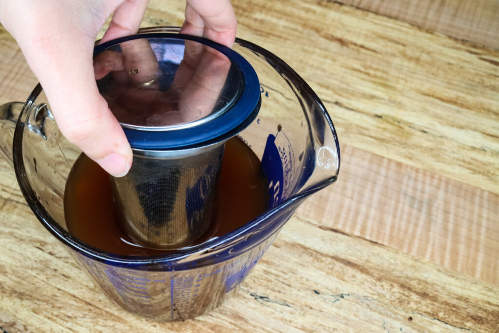black tea straining from chai concentrate