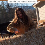 Pinterest pin with an image of a woman lifting a bale of hay. Text overlay says, "How I Stay Fit on the Homestead".