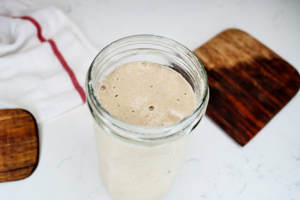 Up close shot of sourdough starter in a jar.