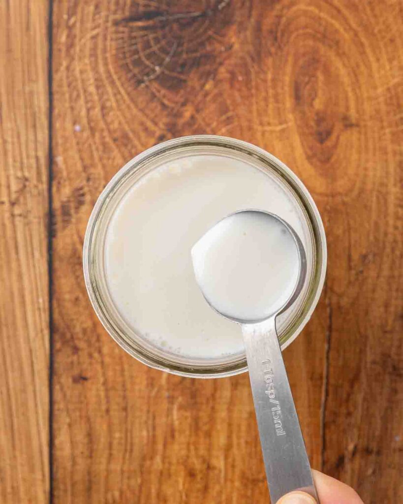 A spoon showing finished buttermilk.