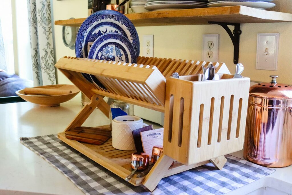 Wooden drying rack sitting on a kitchen counter.