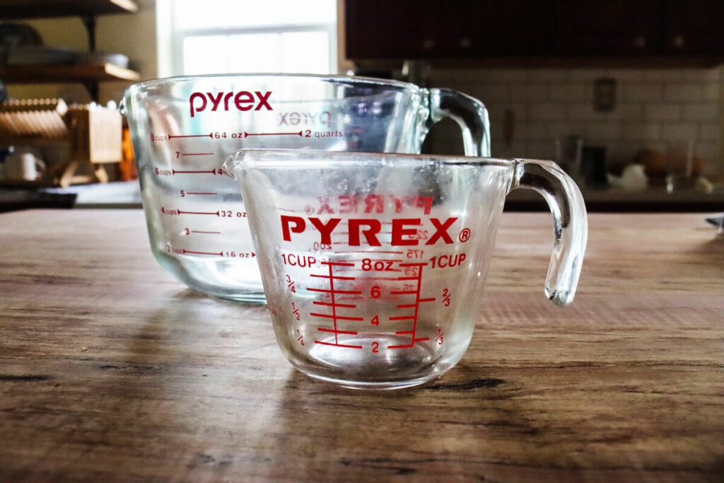 Two sizes of Pyrex glass measuring cups.