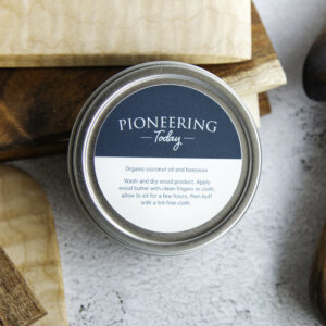 pioneering today wood butter sitting with koa and maple wooden bench knives