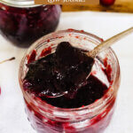 Pinterest pin for homemade cherry jam. Images of cherries and jars of jam.