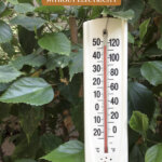 Pinterest pin for how to keep the house cool without electricity or ac. Image of an outdoor thermostat reading 110 degrees F.