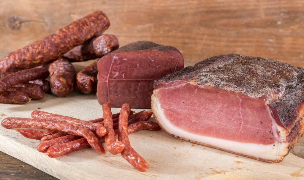 Cured meats sitting on a counter.