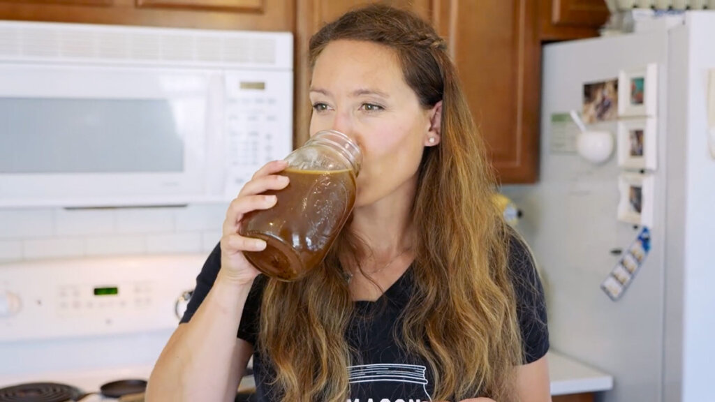 Woman drinking ginger water.