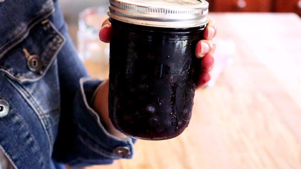 Finished fruit vinegar in a sealed jar.