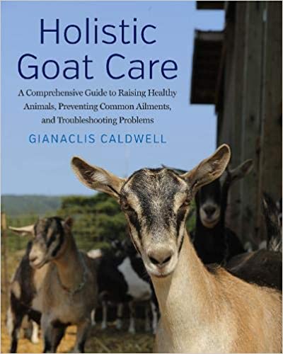 Book cover for Holistic Goat Care. Image of goats next to a large barn.