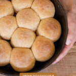 Pinterest pin for homemade dinner rolls. Image of hot rolls slathered in butter.