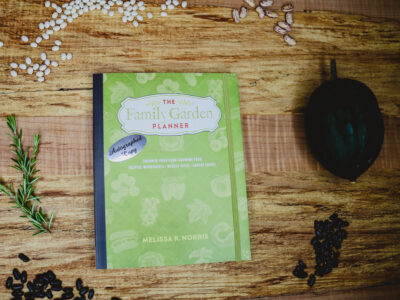 The family garden planner on a wooden counter top.