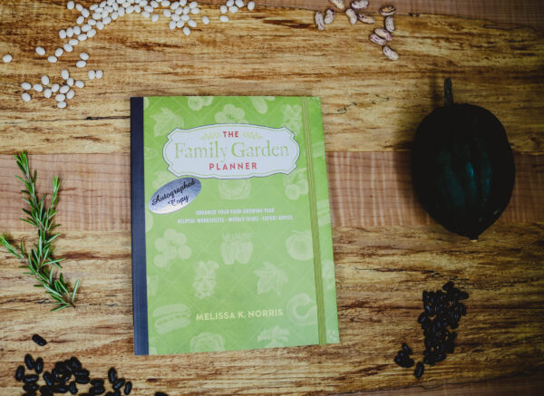 The family garden planner on a wooden counter top.