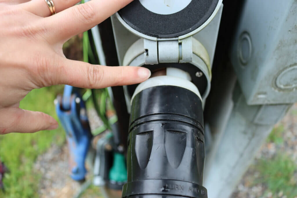 Photo of a power plug going into an electrical box.