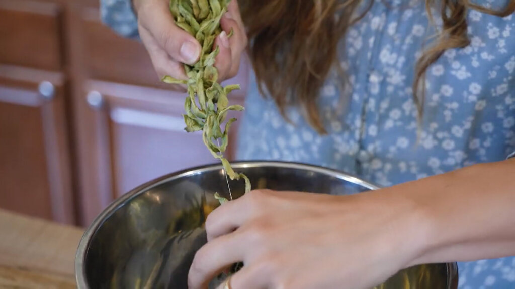 Taking leather britches off the string and into a bowl.