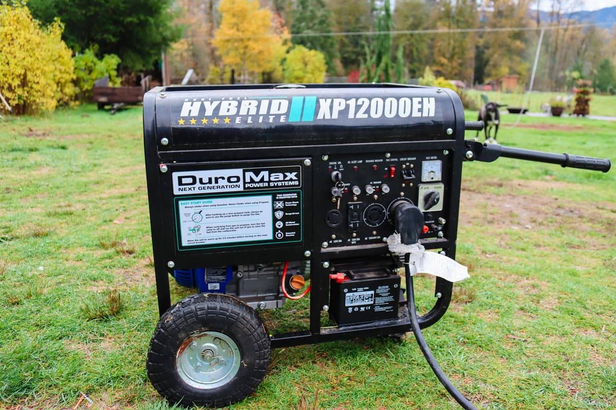 Photo of a generator sitting in a yard.