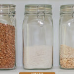 Pinterest pin for how to stock a pantry. Image of pantry staples.