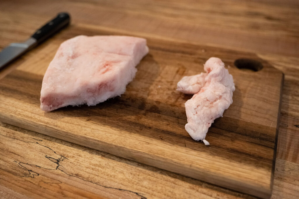 Leaf lard and backfat on a cutting board.