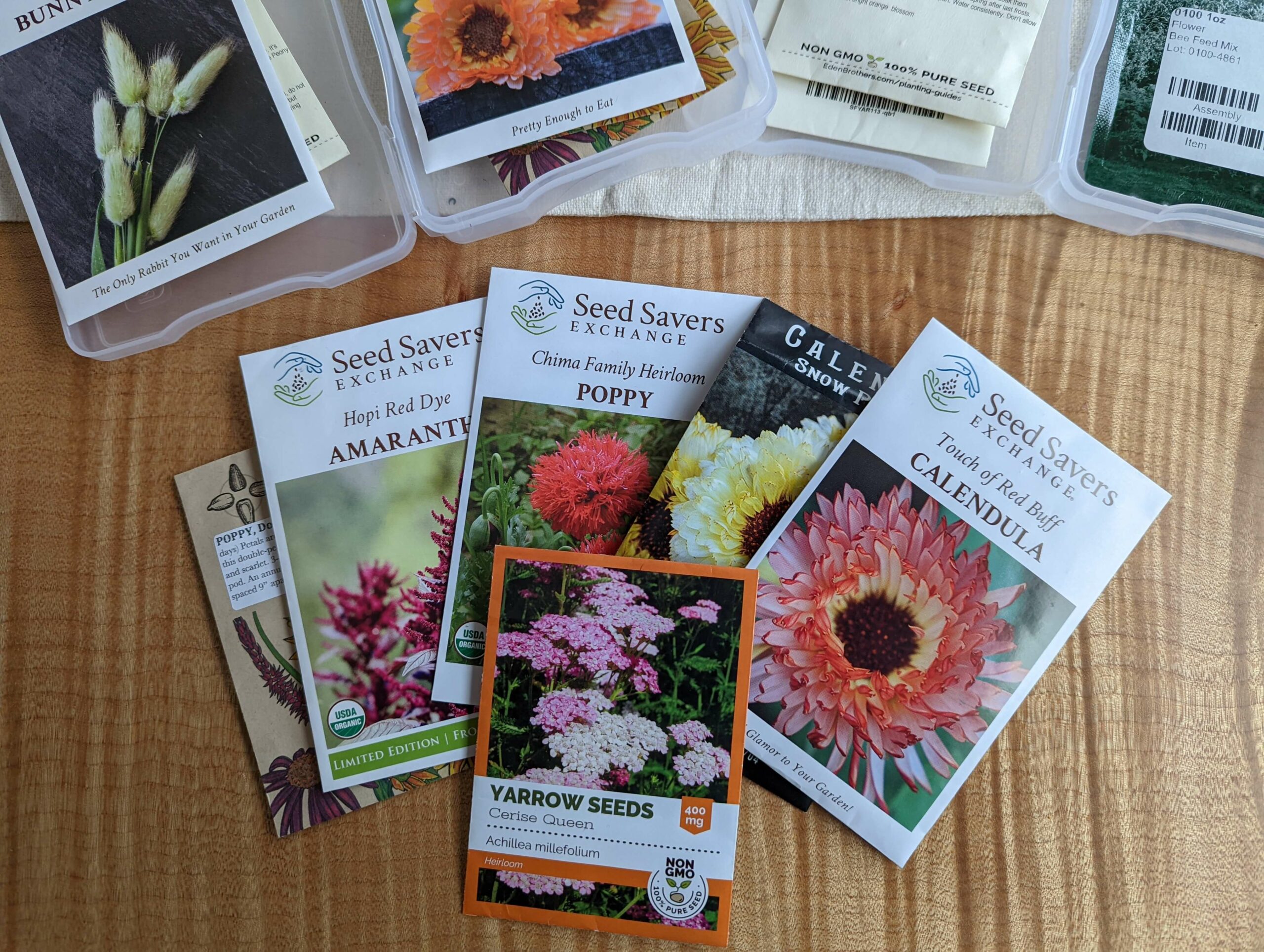 Image of herbal seed packets laid out on a table.
